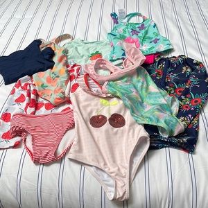 Lot of 7 swimsuits plus a navy rash guard